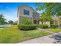 Inviting front exterior with lush landscaping, showcasing the home's curb appeal at 16043 Pebble Bluff Loop, Winter Garden, FL 34787