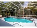 Gorgeous private pool with a waterfall feature and screened-in lanai, perfect for outdoor relaxation at 1718 Elaine Ave, Altamonte Springs, FL 32701