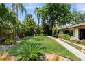 Lush backyard with mature landscaping and a well maintained lawn at 195 E Faith Ter, Maitland, FL 32751