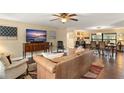 Inviting living room with hardwood floors and views to the dining room at 195 E Faith Ter, Maitland, FL 32751