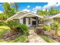 Charming one-story house with manicured landscaping and a welcoming entrance at 2108 Silver Leaf Ct, Longwood, FL 32779