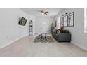 Inviting living room with tile flooring, contemporary furnishings, and an open layout for entertaining at 2618 Sidney Ave, Orlando, FL 32810