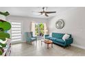 Stylish living room with large windows, a comfortable sofa, and modern furnishings at 2707 E Marks St, Orlando, FL 32803