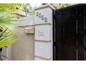 Welcoming entrance featuring a decorative address plaque and a secure wooden gate at 2711 Parkland Dr, Winter Park, FL 32789