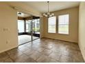 Dining area with sliding glass doors leading to a screened lanai at 274 Brunswick Dr, Davenport, FL 33837