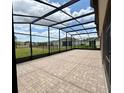 Spacious screened lanai with brick pavers, perfect for outdoor entertaining and relaxation at 274 Brunswick Dr, Davenport, FL 33837