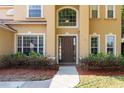 Elegant front entrance showcasing a beautiful door with sidelights and manicured landscaping at 2780 Running Springs Loop, Oviedo, FL 32765