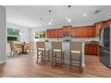 Bright kitchen with an island and adjacent dining area, perfect for entertaining at 5839 Tarleton Way, Mount Dora, FL 32757