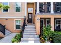 Inviting entrance showcasing steps leading to the front door with a lovely wreath at 1065 Clifton Springs Ln, Winter Springs, FL 32708