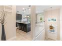 Modern kitchen with dark cabinets, stainless steel appliances, and an island at 1065 Clifton Springs Ln, Winter Springs, FL 32708