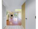 Bright living room boasting fireplace, hardwood floors, and access to outdoor patio at 135 Heron Bay Cir, Lake Mary, FL 32746
