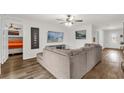 Cozy living room featuring wood-look floors, modern decor, and comfortable seating at 1898 9Th Ave, Deland, FL 32724