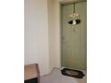 Condo unit front door with a wreath and welcome mat, creating a warm and inviting entrance at 204 Terrace Ridge Cir # 204, Davenport, FL 33896