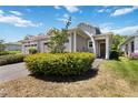 Well-maintained home featuring a two-car garage and a beautifully paved driveway, green lawn and charming entryway at 2423 Datura Loop, St Cloud, FL 34772