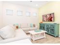 Cozy living room with a comfortable sofa and entertainment center, perfect for relaxing at 2988 Salted Rim Rd, Kissimmee, FL 34747