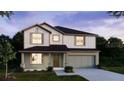 Charming two-story home with shake siding, a two-car garage, and a well-manicured lawn at dusk at 3242 Viceroy Ct, Poinciana, FL 34759