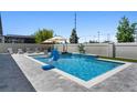 Inviting pool area featuring a waterfall, lounge chairs, and well-maintained patio, perfect for outdoor relaxation at 3332 Lone Cypress Pt, Oviedo, FL 32765