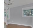 Bright and open living room featuring hardwood floors and a window at 3605 Pershing Ave, Orlando, FL 32812