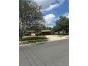 Street view of a single story home with a brick facade and front yard landscaping at 5811 Harcourt Ave, Orlando, FL 32839