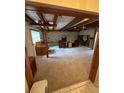 Spacious living area featuring a large brick fireplace and wood beam construction at 5811 Harcourt Ave, Orlando, FL 32839