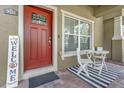 Charming front porch with seating area and modern decor at 9112 Grey Moss Dr, Orlando, FL 32832