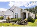 Lovely single-story home boasting a well-manicured lawn and inviting front entrance at 10166 Hidden Dunes Ln, Orlando, FL 32832