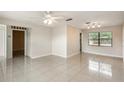 Spacious living area featuring tile floors and plenty of natural light at 1030 Blue Horizon Dr, Deltona, FL 32725