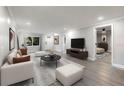 Bright living room featuring modern furniture, decor, and hardwood floors at 120 East St, Altamonte Springs, FL 32701