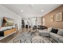 Stylish living room with contemporary furniture, a modern rug, and an open layout at 1801 Nice Ct, Kissimmee, FL 34747