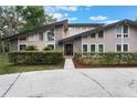 Charming front exterior with a well-maintained lawn, stylish stone accents, and a modern design at 202 Sweetwater Club Blvd, Longwood, FL 32779