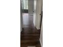 Hallway with wood-look floors that leads to screened porch at 2301 Oak Park Way # 101, Orlando, FL 32822