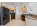 Well-equipped kitchen featuring modern appliances and stylish granite countertops at 411 Terrace Ridge Cir # 222, Davenport, FL 33896