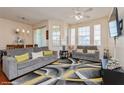 Bright living room featuring plush seating, modern décor, and plenty of natural light at 411 Terrace Ridge Cir # 222, Davenport, FL 33896