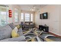 Cozy living room featuring modern décor and plenty of natural light at 411 Terrace Ridge Cir # 222, Davenport, FL 33896