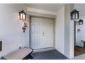 Inviting double front doors enhance curb appeal and welcome you home, featuring overhead lighting and unit number at 6330 Masters Blvd # N4, Orlando, FL 32819