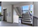 Well-maintained staircase area providing access to upper floors, complemented by an elevator for added convenience at 6330 Masters Blvd # N4, Orlando, FL 32819