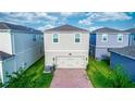 Charming home with a two-car garage, brick driveway, and well-manicured lawn in a suburban neighborhood at 635 Cheval Ln, Debary, FL 32713
