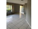 Spacious living room with tile floors and a large window offering natural light at 2342 Cilantro Dr, Orlando, FL 32837