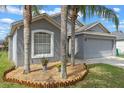 Charming single-story home with a two-car garage and well-maintained lawn at 2407 Oakington St, Winter Garden, FL 34787