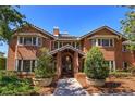 Charming two-story red brick home with meticulously maintained landscaping and covered entryway at 2828 Marquesas Ct, Windermere, FL 34786