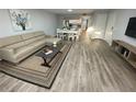 Comfortable living room with modern decor, dining table, and hard surface floors at 3147 Britannia Blvd # A, Kissimmee, FL 34747
