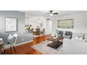 Bright living room featuring hardwood floors, neutral paint and decor and kitchen access at 320 Lakeview St # 214, Orlando, FL 32804