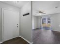 Welcoming entryway leading to a bright living space with a ceiling fan at 4136 Pershing Pointe Pl # 2, Orlando, FL 32822