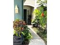 Charming front porch entrance with plants leading to the main door at 5114 Hawkstone Dr, Sanford, FL 32771