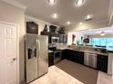 Well-equipped kitchen featuring stainless steel appliances and granite countertops, perfect for cooking at 5114 Hawkstone Dr, Sanford, FL 32771