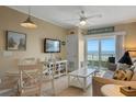 Cozy living room featuring tile floors, comfortable seating, and beach view at 611 S Atlantic Ave # 4212, New Smyrna Beach, FL 32169