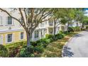 Charming condo building with well-maintained grounds, perfect for a peaceful and relaxing lifestyle at 7509 Mourning Dove Cir # 203, Reunion, FL 34747