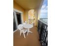 Cozy balcony with table and chairs, perfect for enjoying the view at 8101 Resort Village Dr # 3909, Orlando, FL 32821