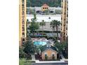 View of the pool and commercial area from the condominium complex at 8101 Resort Village Dr # 3909, Orlando, FL 32821