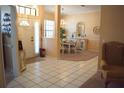 Bright foyer with tile flooring leading to the formal dining area at 859 Morning Star Dr, Lakeland, FL 33810